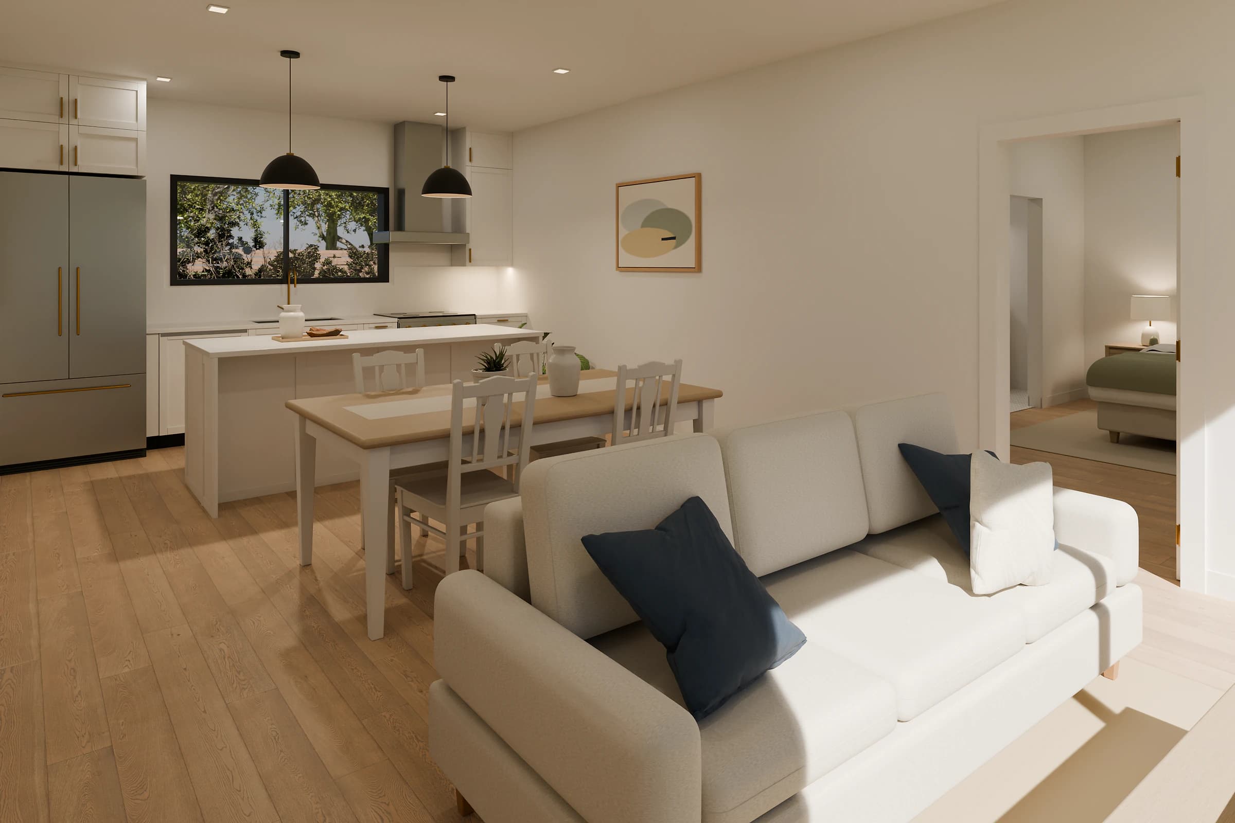 Rendering of the Two Bedroom + Office ADU living room, a cream sofa with navy and white pillows in front of a light wood dining table with white chairs, open to a white quartz island, a stainless refrigerator and a window over the sink, with a bedroom through the doorway on the right